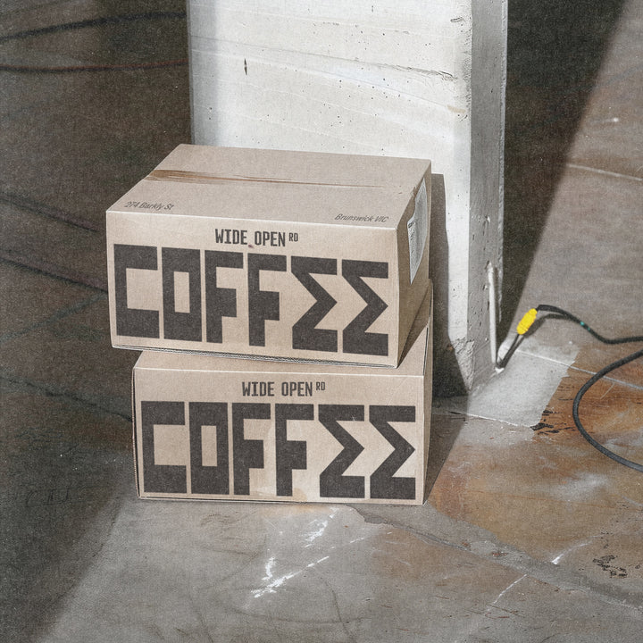 Photo of a box of Melbourne wholesale specialty coffee. 2 boxes with COFFEE on them. Wide Open RD specialty coffee Brunswick.